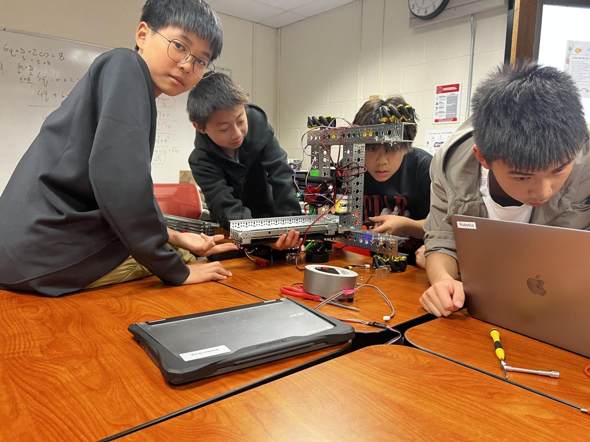 Robotics Club members work on the design of this year's robot, which will compete with other schools this year in the FIRST Tech Challenge.